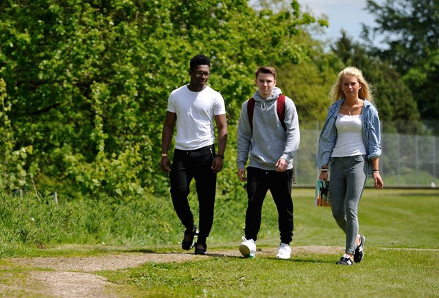 Four Myerscough College students walking through the Preston Campus